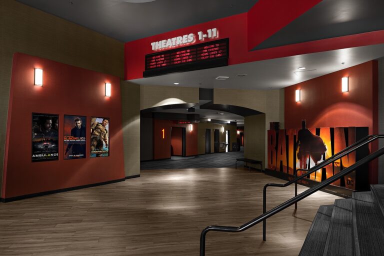 Interior hallway of a movie theater.