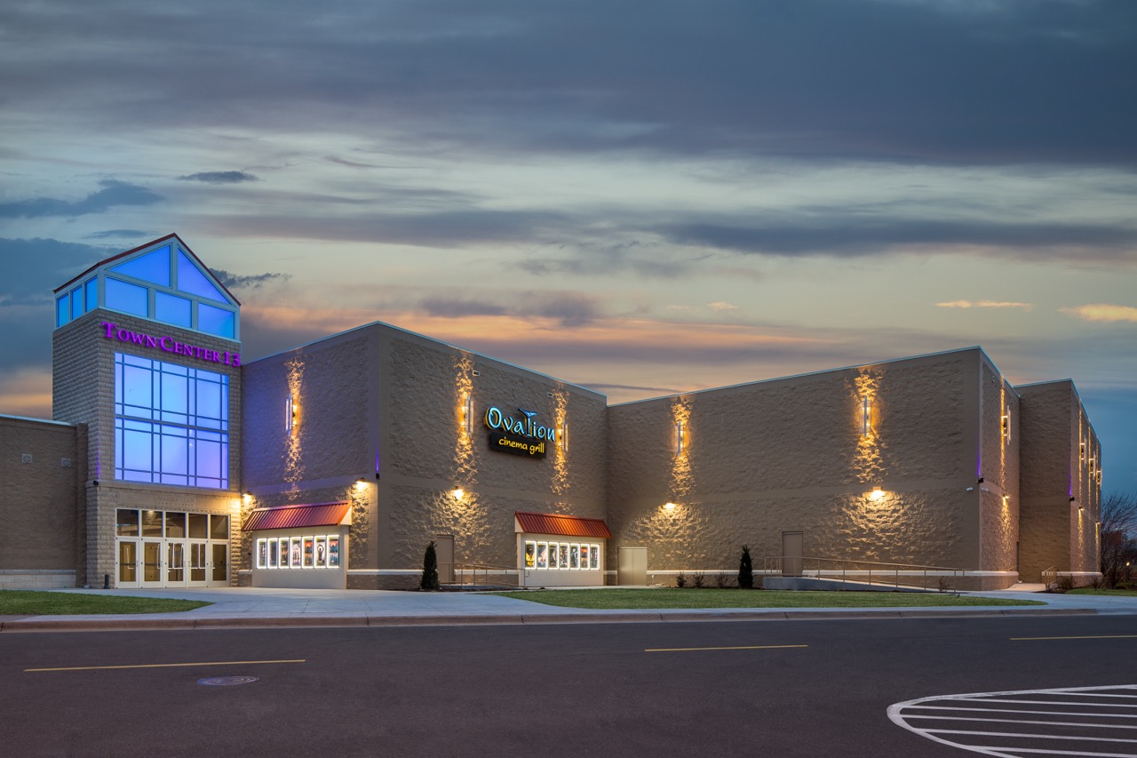 Exterior shot of movie theater at night.
