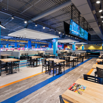 Tables and seating at a lounge space at Round1