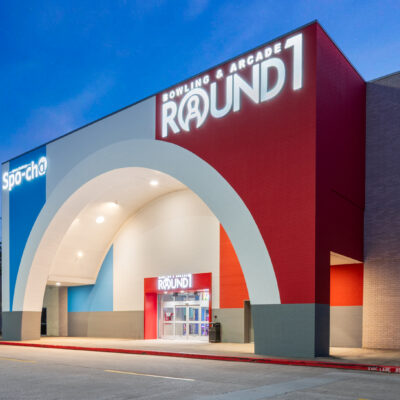 Exterior entrance to Round1 Willowbrook at dusk.