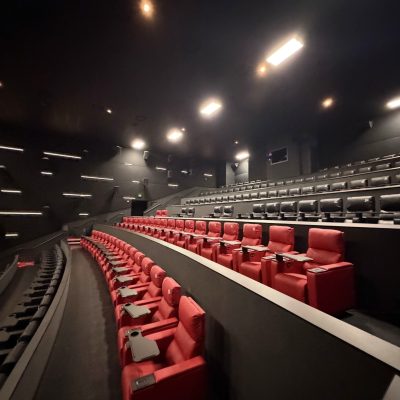 Theater seats overlooking a movie screen in Carson, CA
